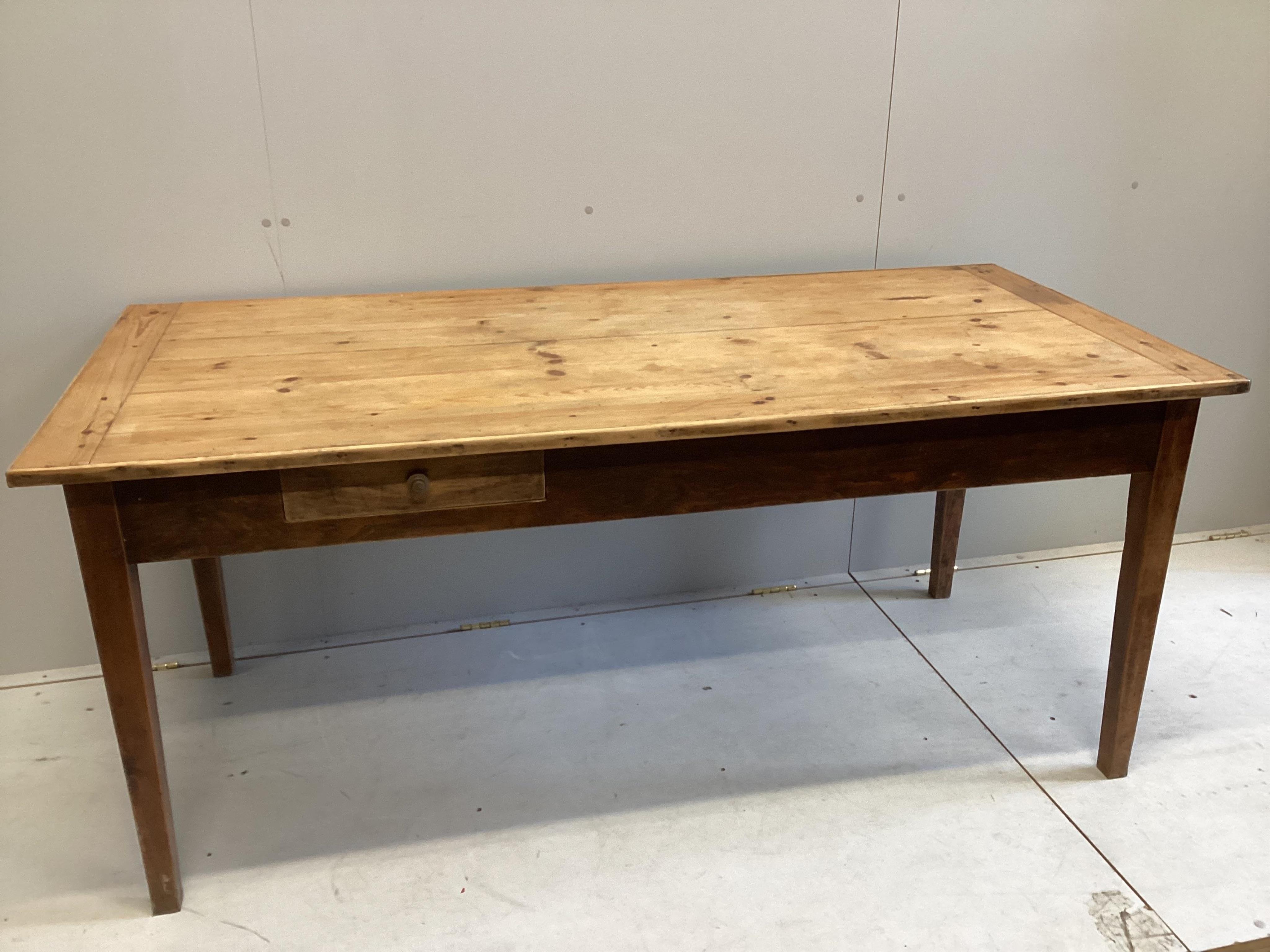 A 19h century French rectangular pine and fruitwood two drawer kitchen table, width 172cm, depth 78cm, height 76cm. Condition - fair, top with slightly opened joints and has traces of old worm.